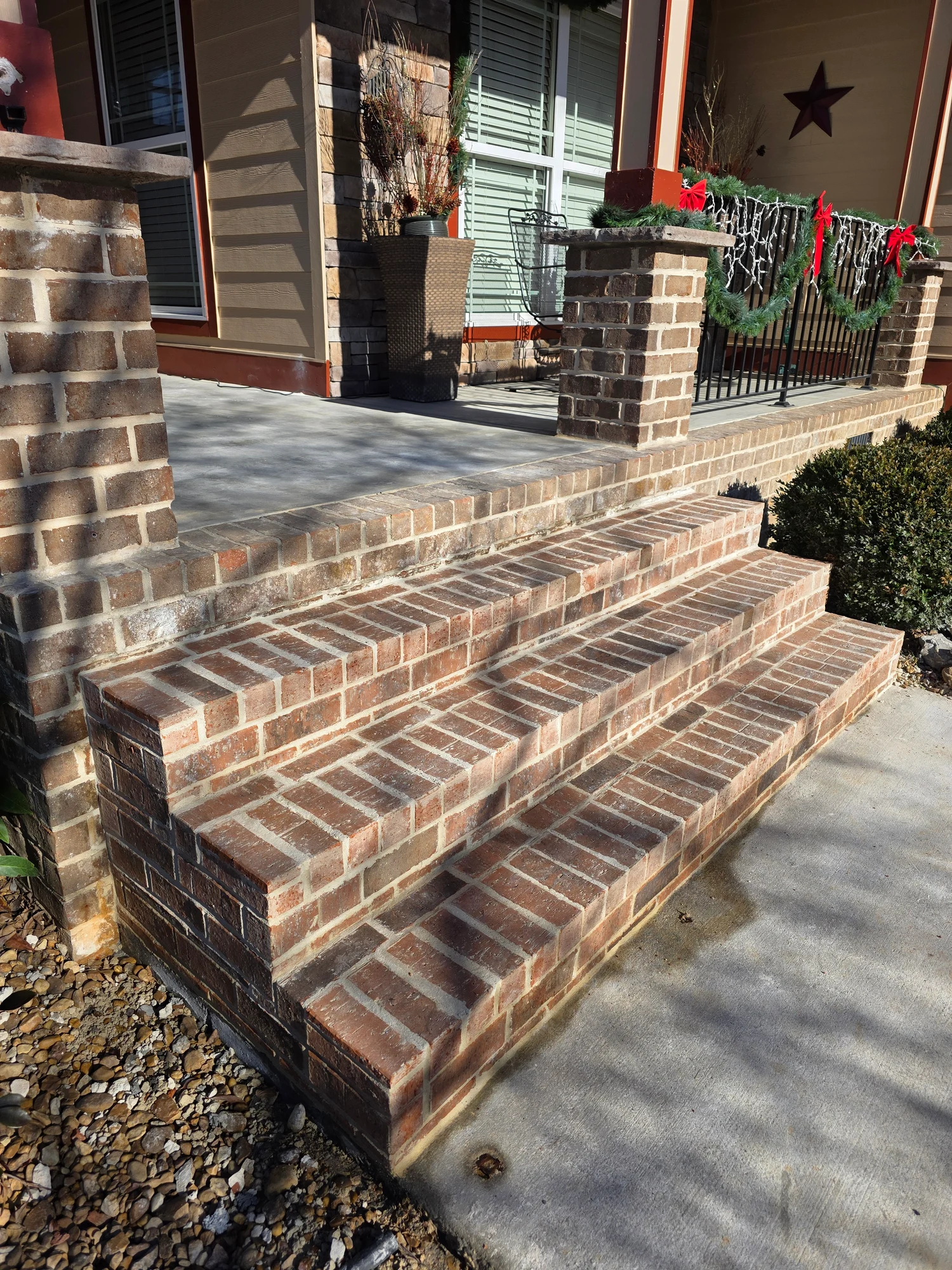 Brick porch and iron railing