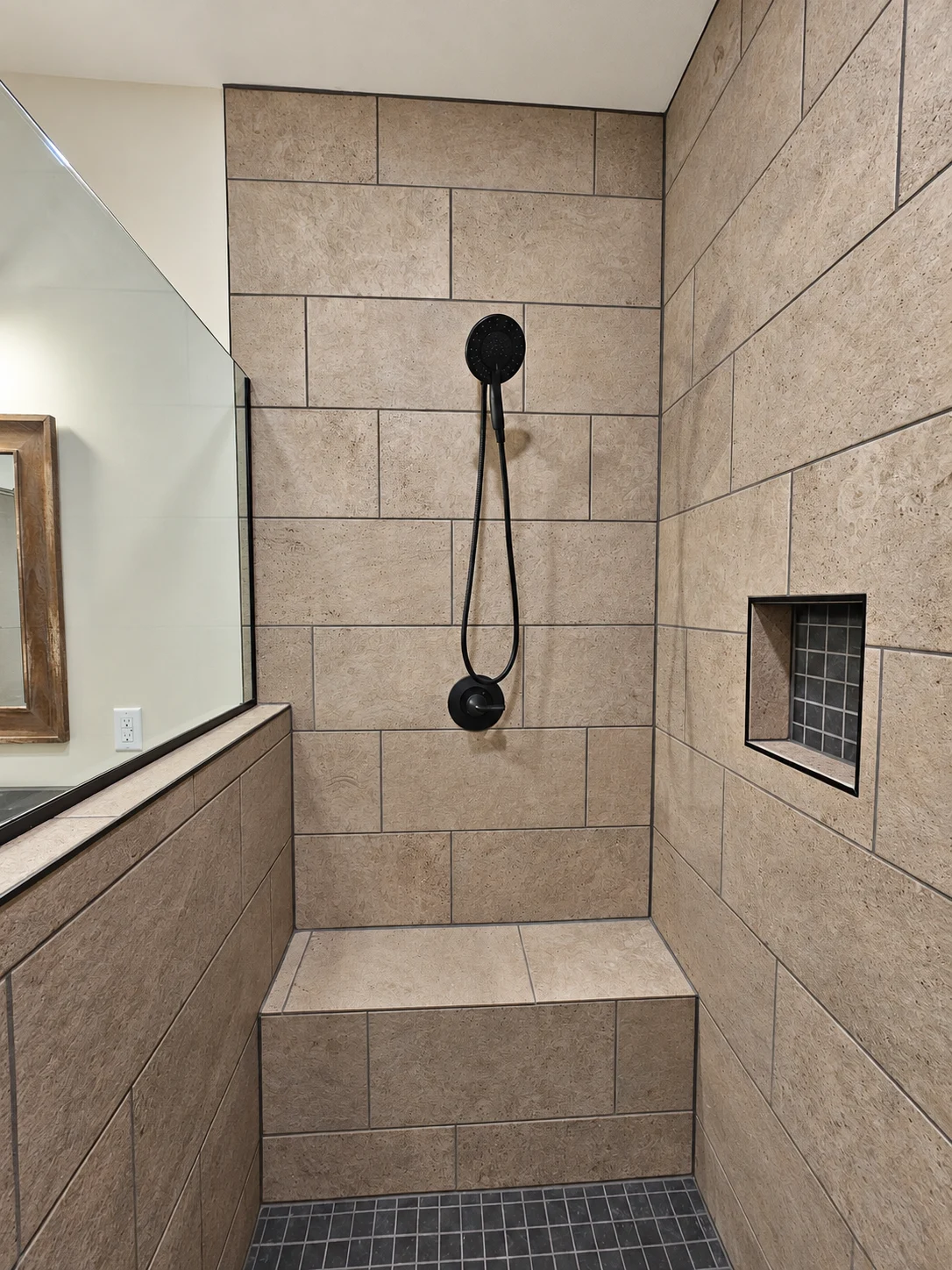 Shower bench and black fixtures